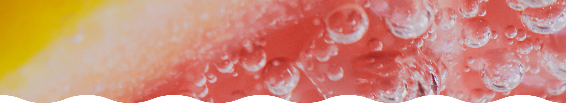 Close-up of bubbles in water with a gradient background from yellow to red.